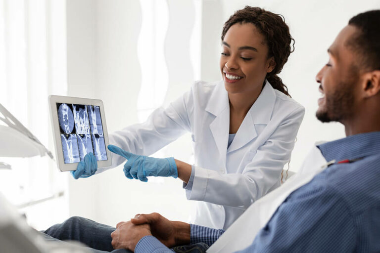dentist explaining an xray to a patient