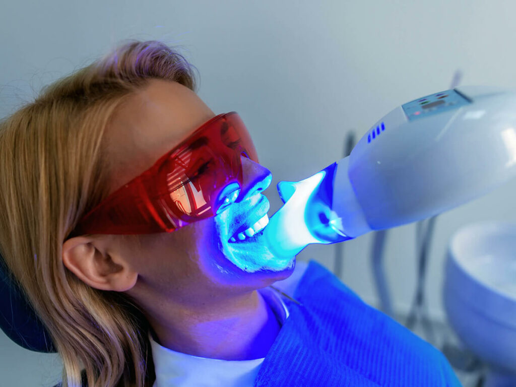 woman receiving teeth whitening
